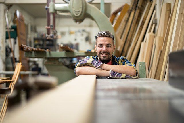 Small Business Insurance — Smiling Young Woodworker in Ferdinand, IN