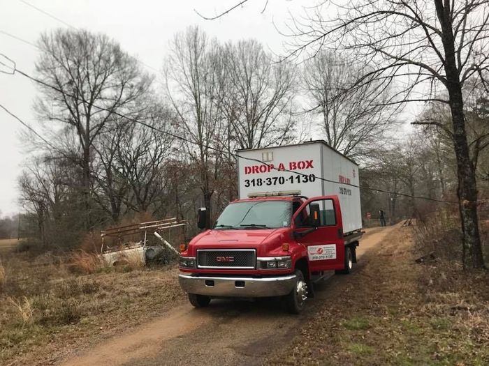 A moving truck is filled with boxes and furniture.