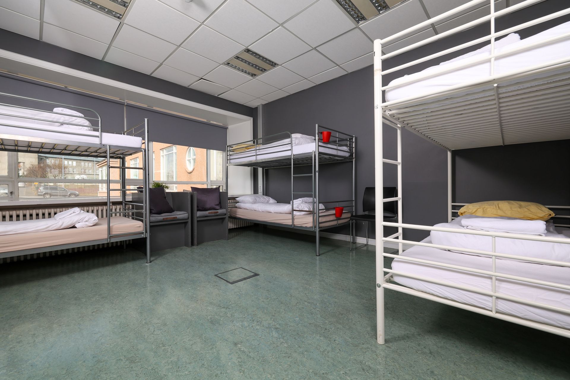 A room with a lot of bunk beds in it