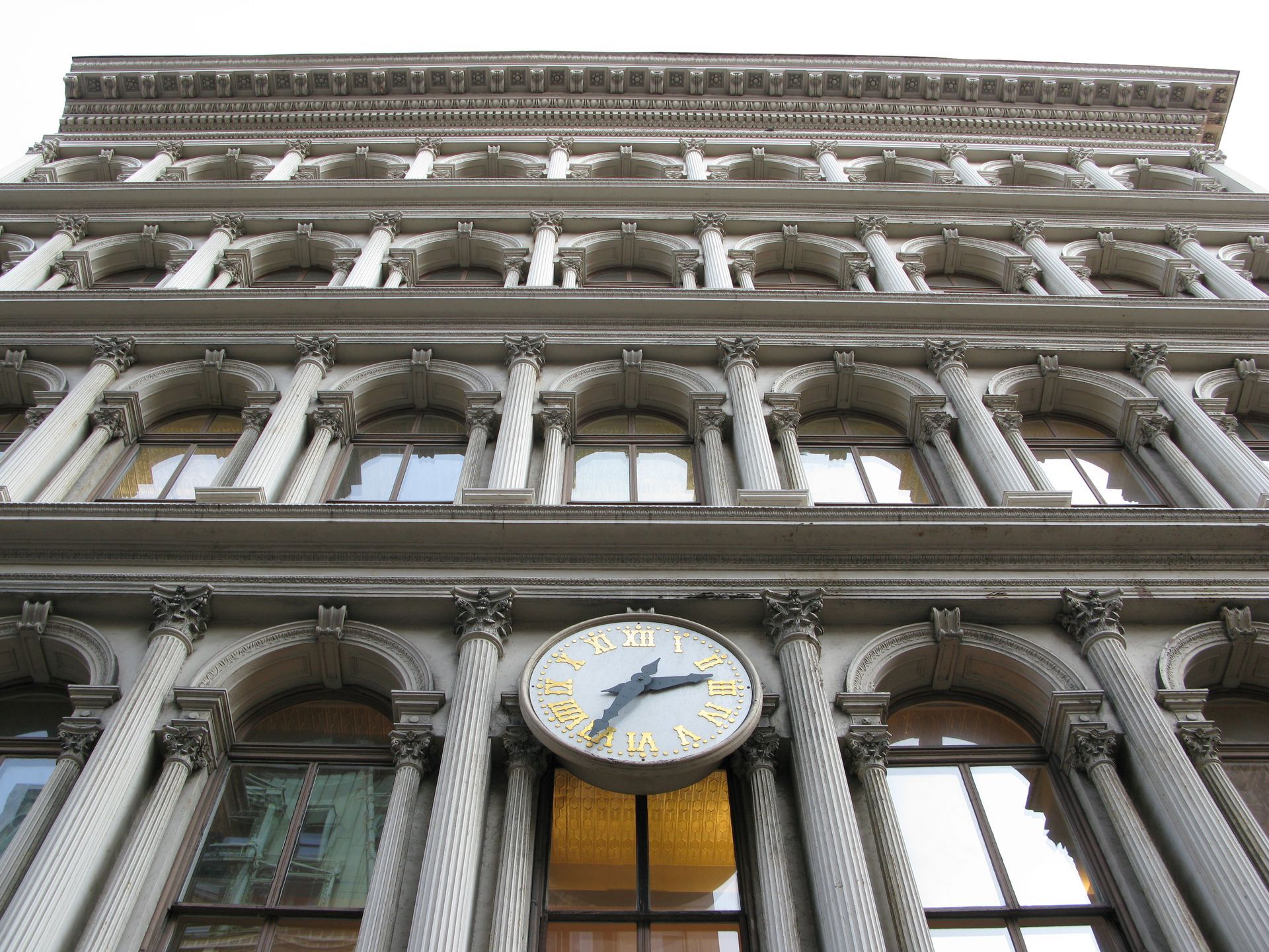 AHLEM eyewear store front with glass windows, sign, and brick building.