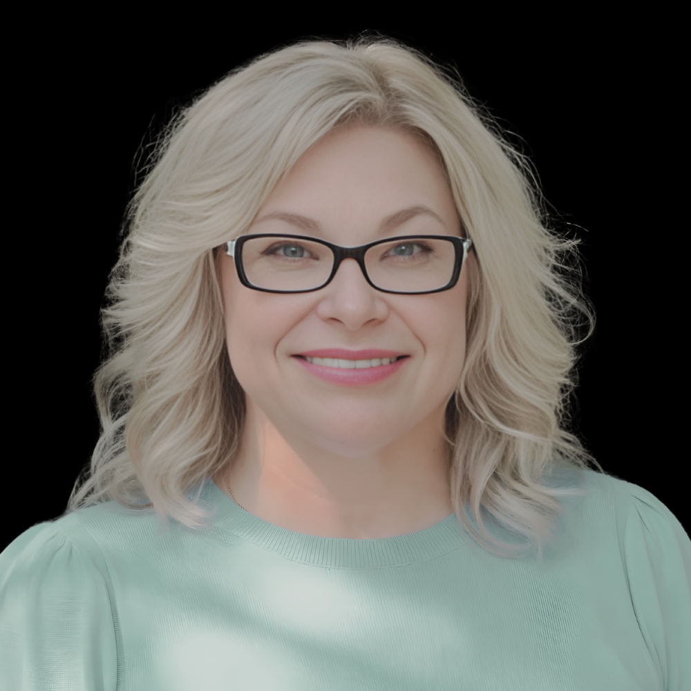 White woman with glasses and blonde hair smiling against grey background