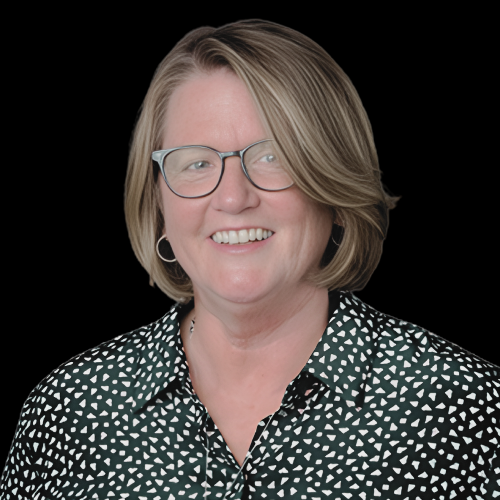 White woman with light brown hair and glasses smiling against a white background