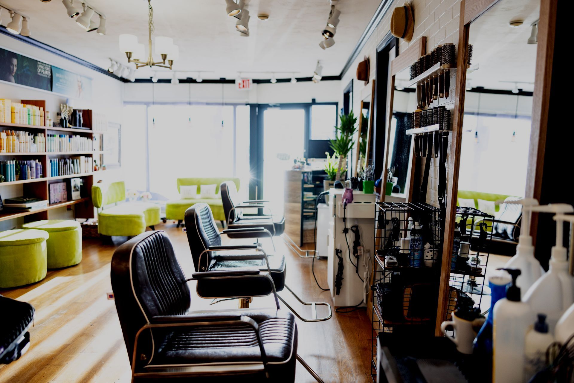 A hair salon with a lot of chairs and mirrors