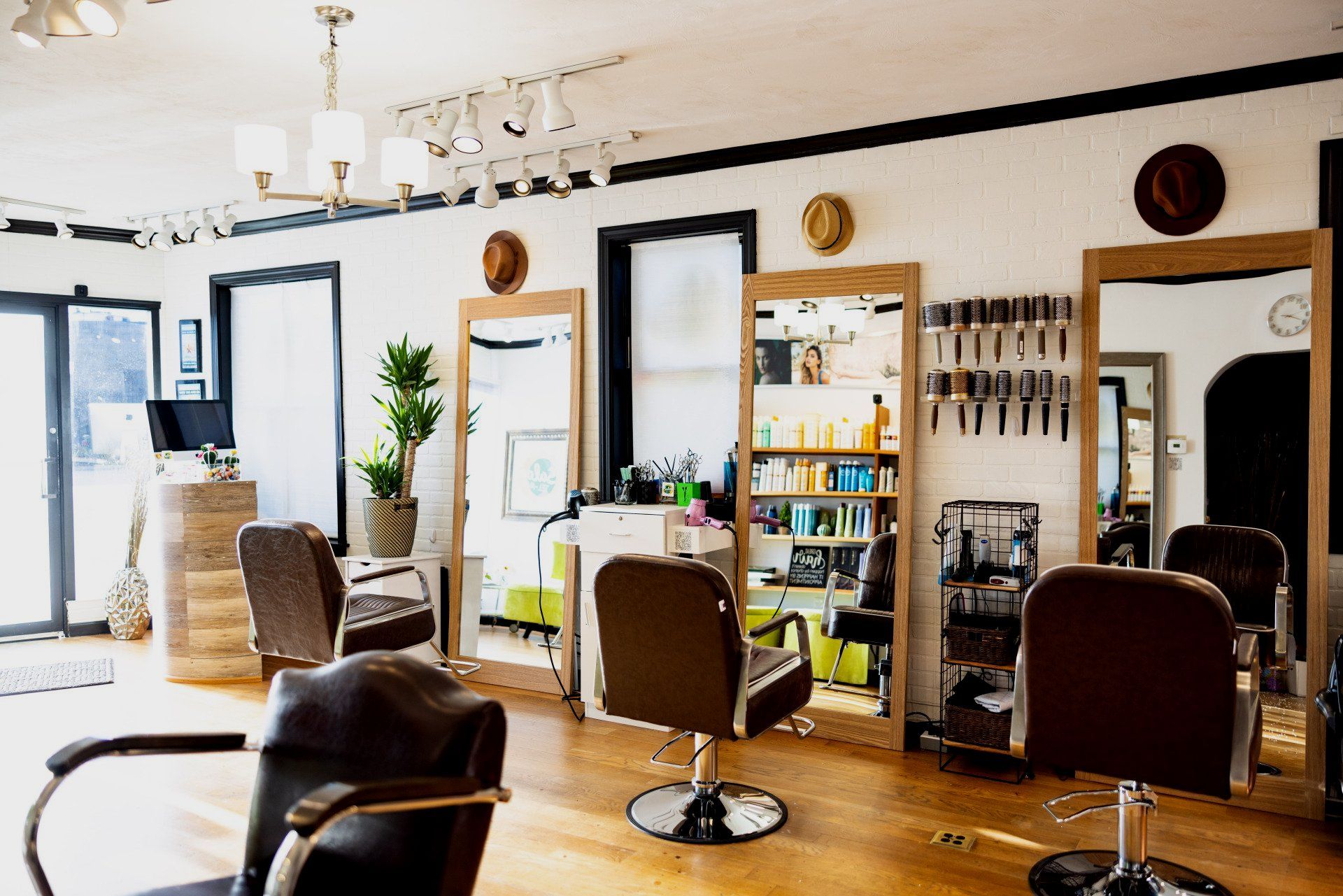 A hair salon with a lot of chairs and mirrors