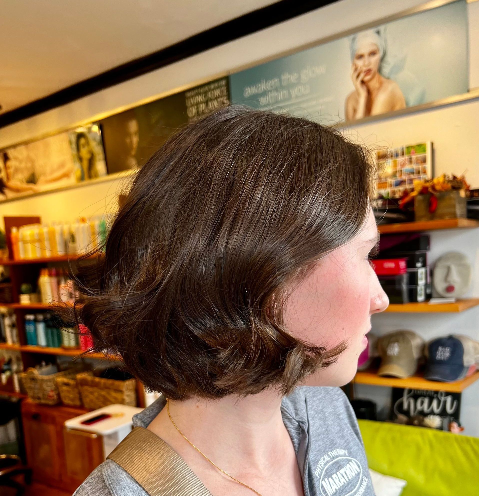 A woman from Norwood MA getting a hair cut at salon tel aviv