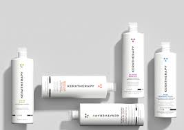 A keratherapy bottles sitting on top of each other on a table.