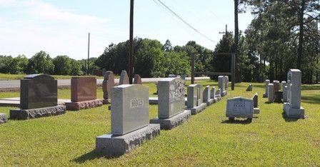 A cemetery with a lot of graves in it