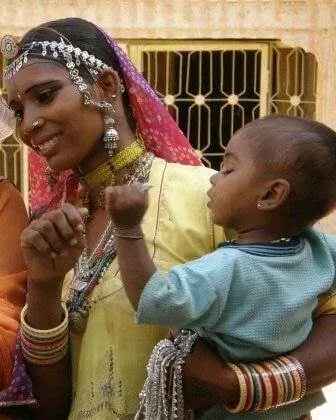 Woman Carrying Her Child — Travel Agents in Burril Lake