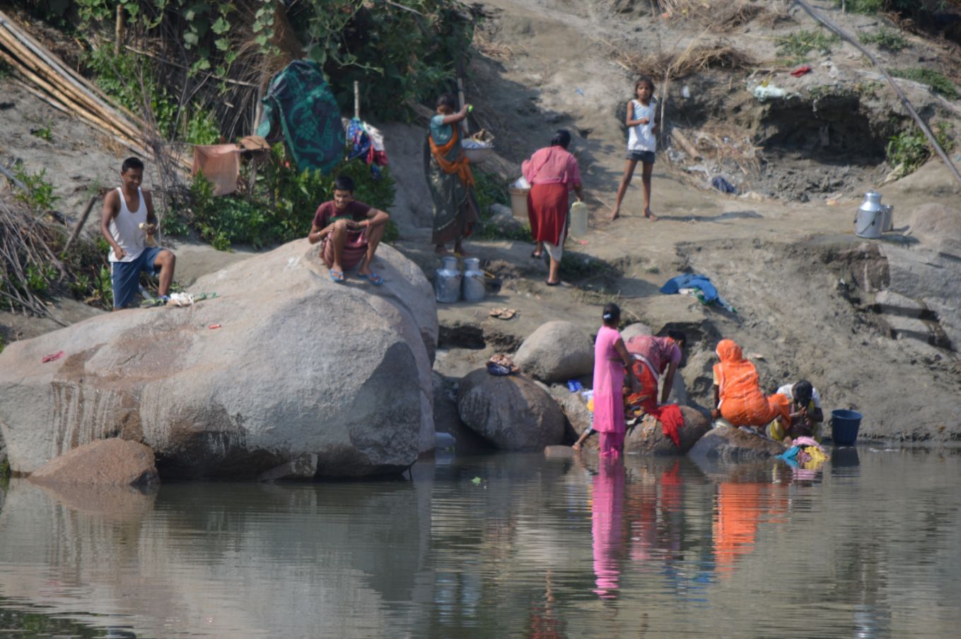 Villagers collecting water and bathing in the Brahmaputra