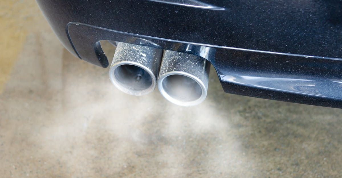 Smoke is coming out of the exhaust pipes of a car.  | Road Ready