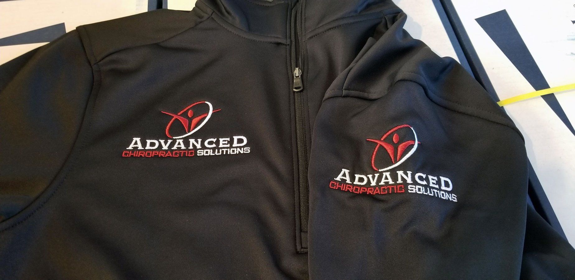 Two black jackets with the word advanced embroidered on them