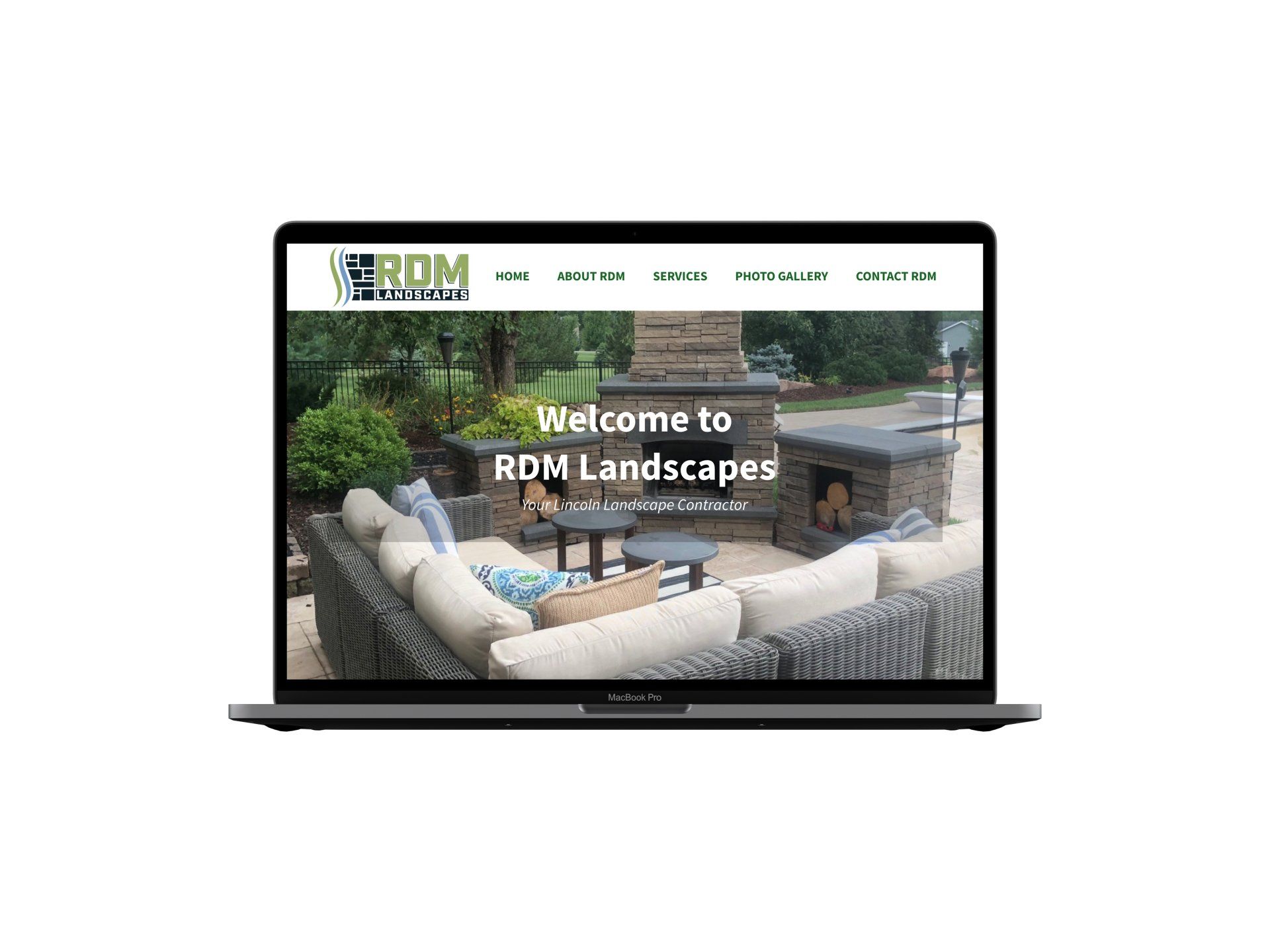 A laptop computer is open to a website for rd landscapes.