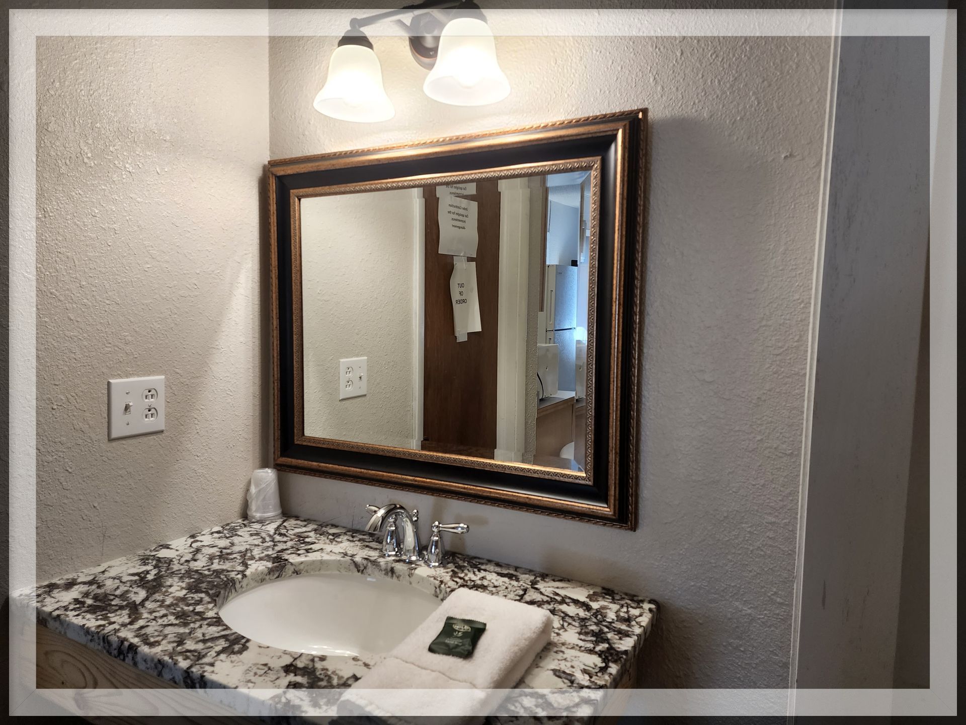 The bathroom image in the Extended Stay Suite with 2 queen beds & 2 bathrooms at the Trails Inn Quadna Motel.