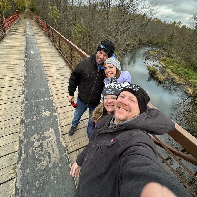 An image of owner Shawn Pehrson with friends on the ATV bridge in Emily, MN,