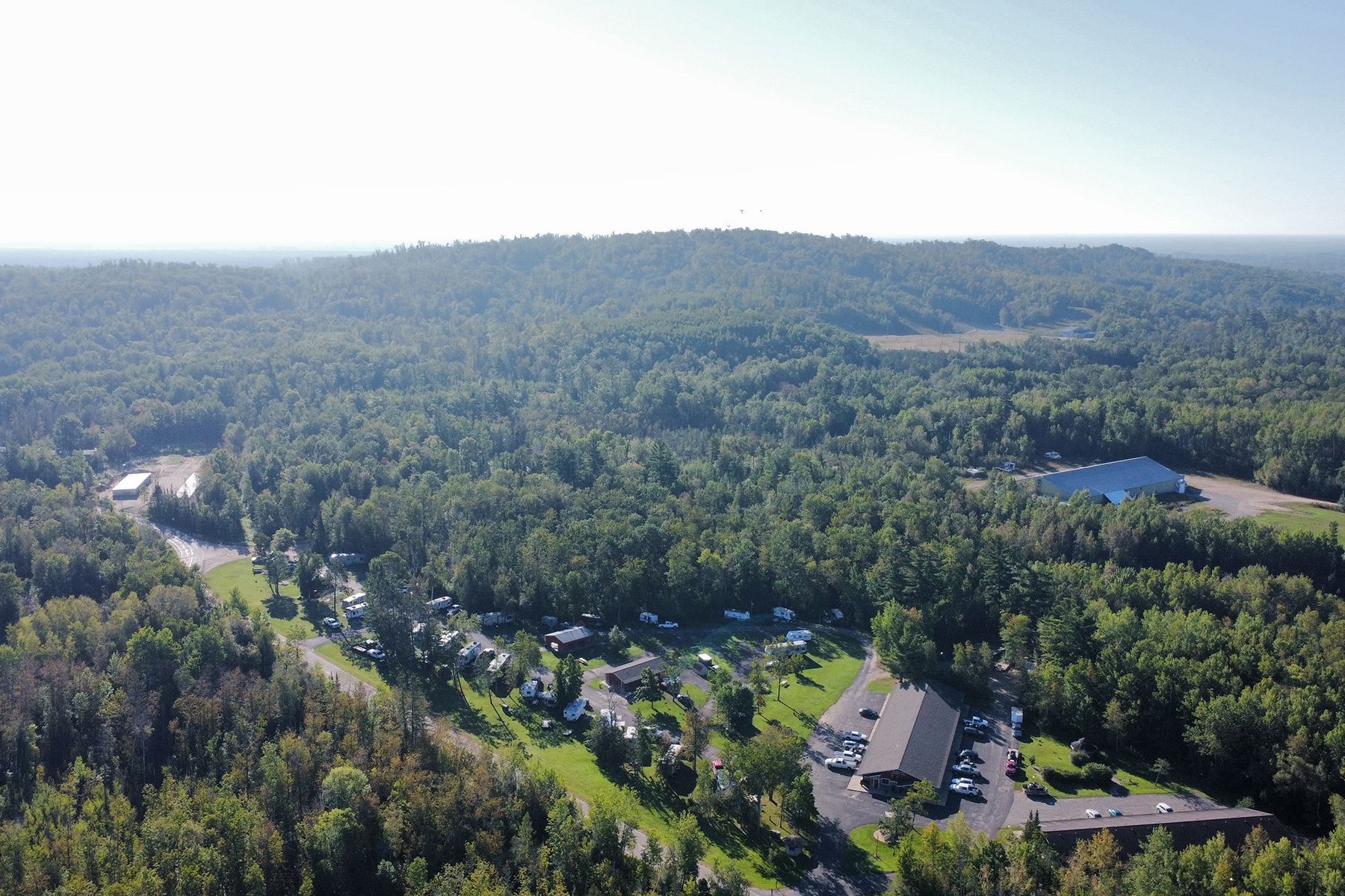 An Aerial view of the Trails Inn Motel, Quadna Mountain, and Snowmobile Paradise.