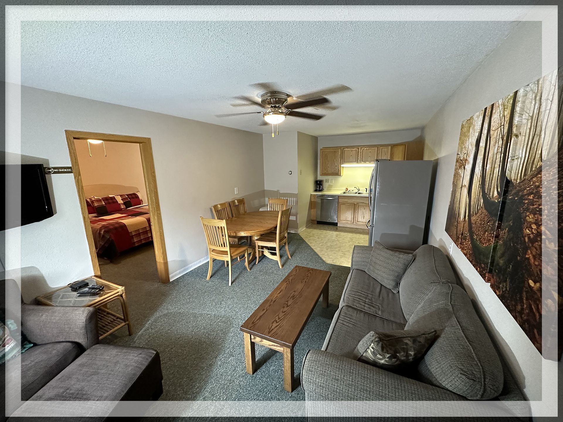 This is a the living room and bedroom entrance of the 1 king bed, 1 queen bed, and 1 bathroom Extended Stay Suite.