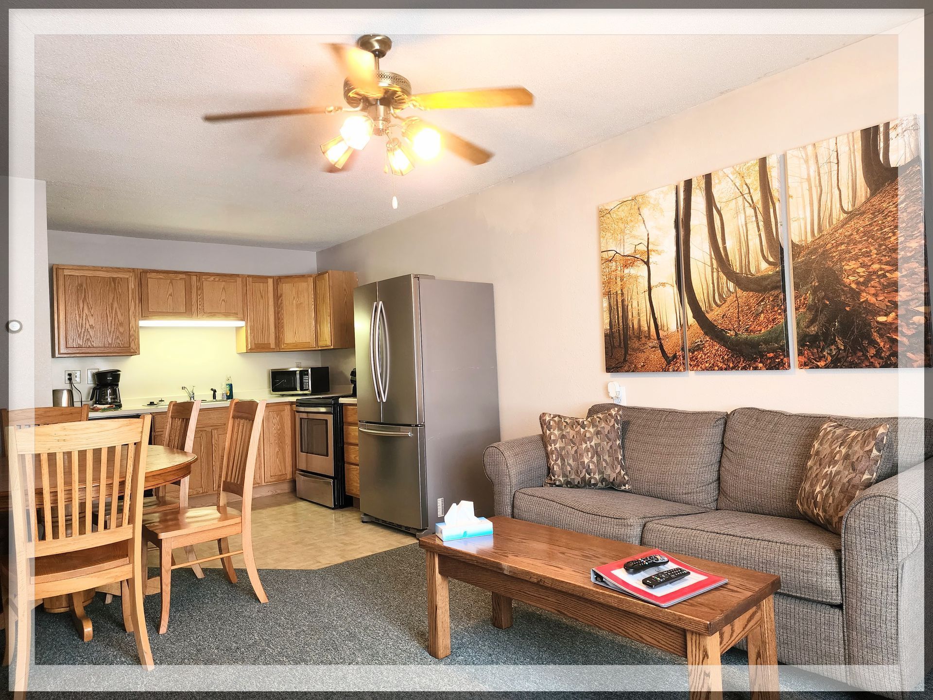 is is a living room and kitchen image in the 1 king bed, 1 queen bed, and 1 bathroom Extended Stay Suite.