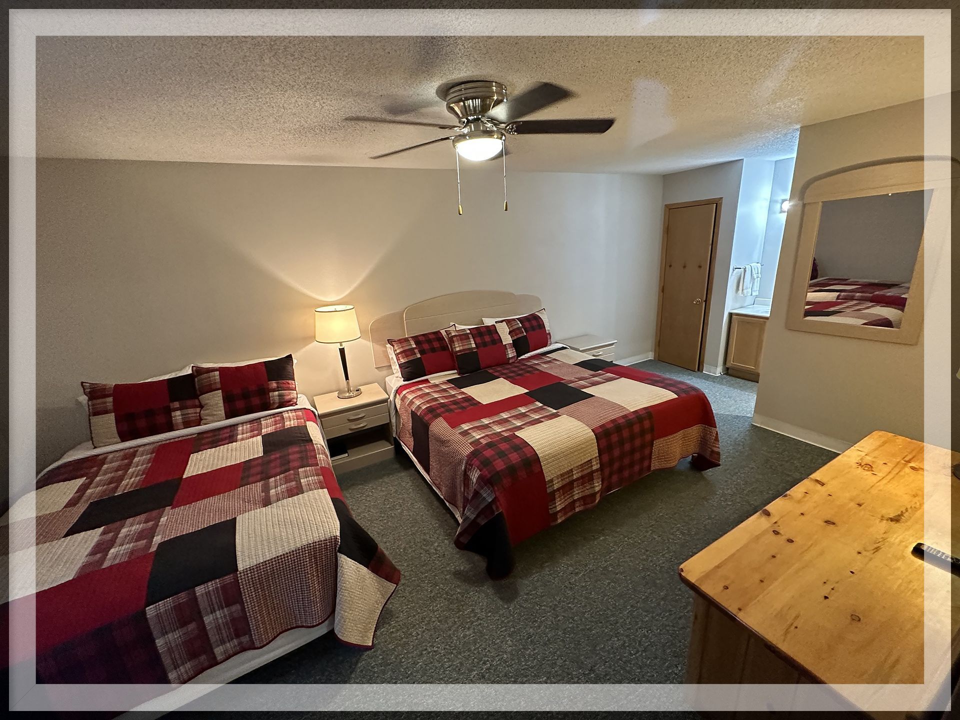 This is a bedroom image in the 1 king bed, 1 queen bed, and 1 bathroom Extended Stay Suite.