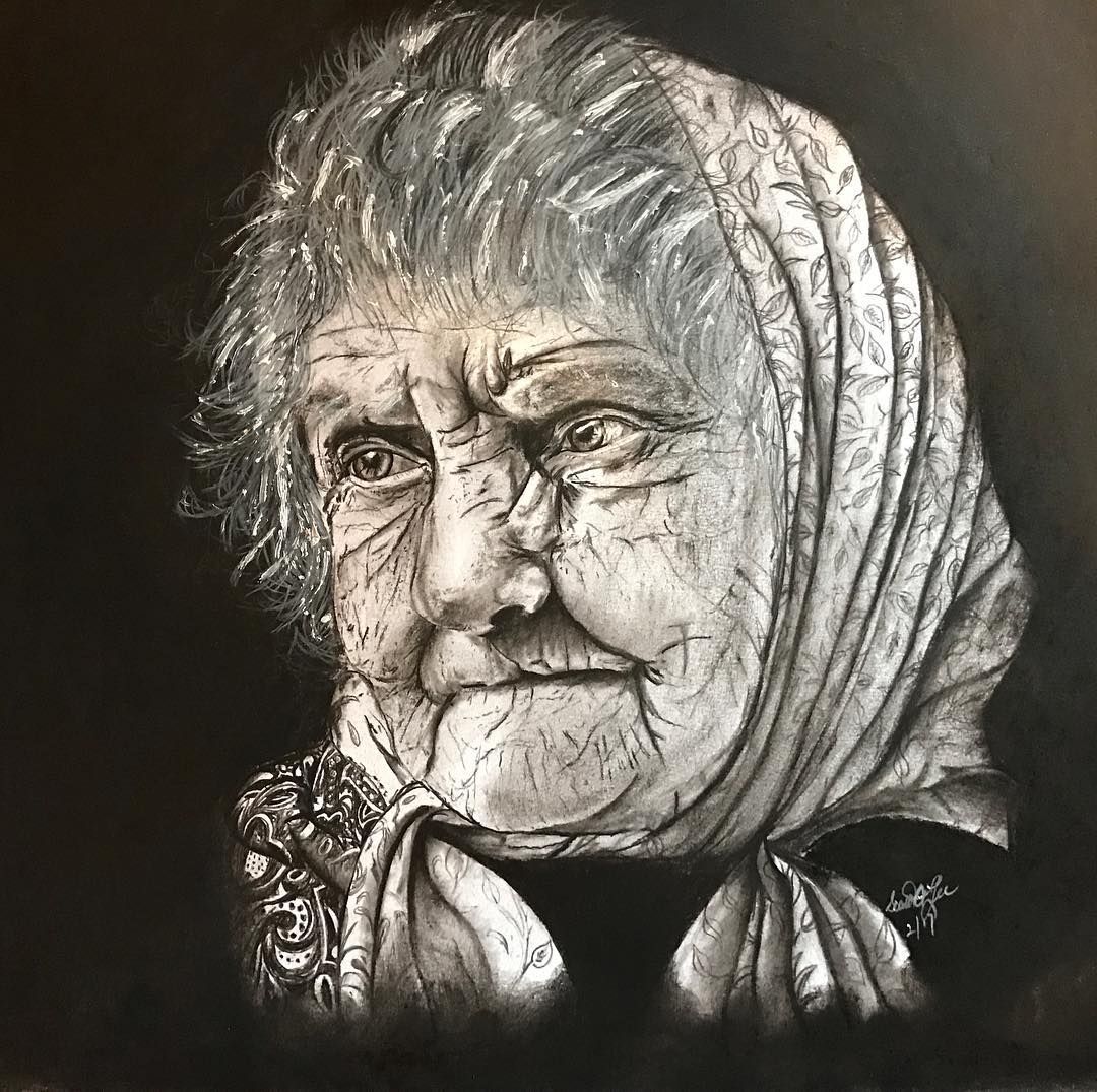 Charcoal drawing of an elderly person. Wrinkled face, white scarf, and somber expression.