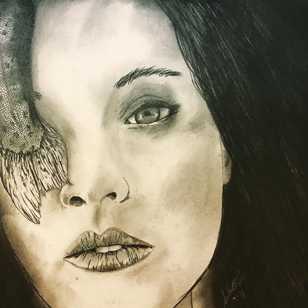 Charcoal portrait of woman with partial bird wing over eye; intense gaze.