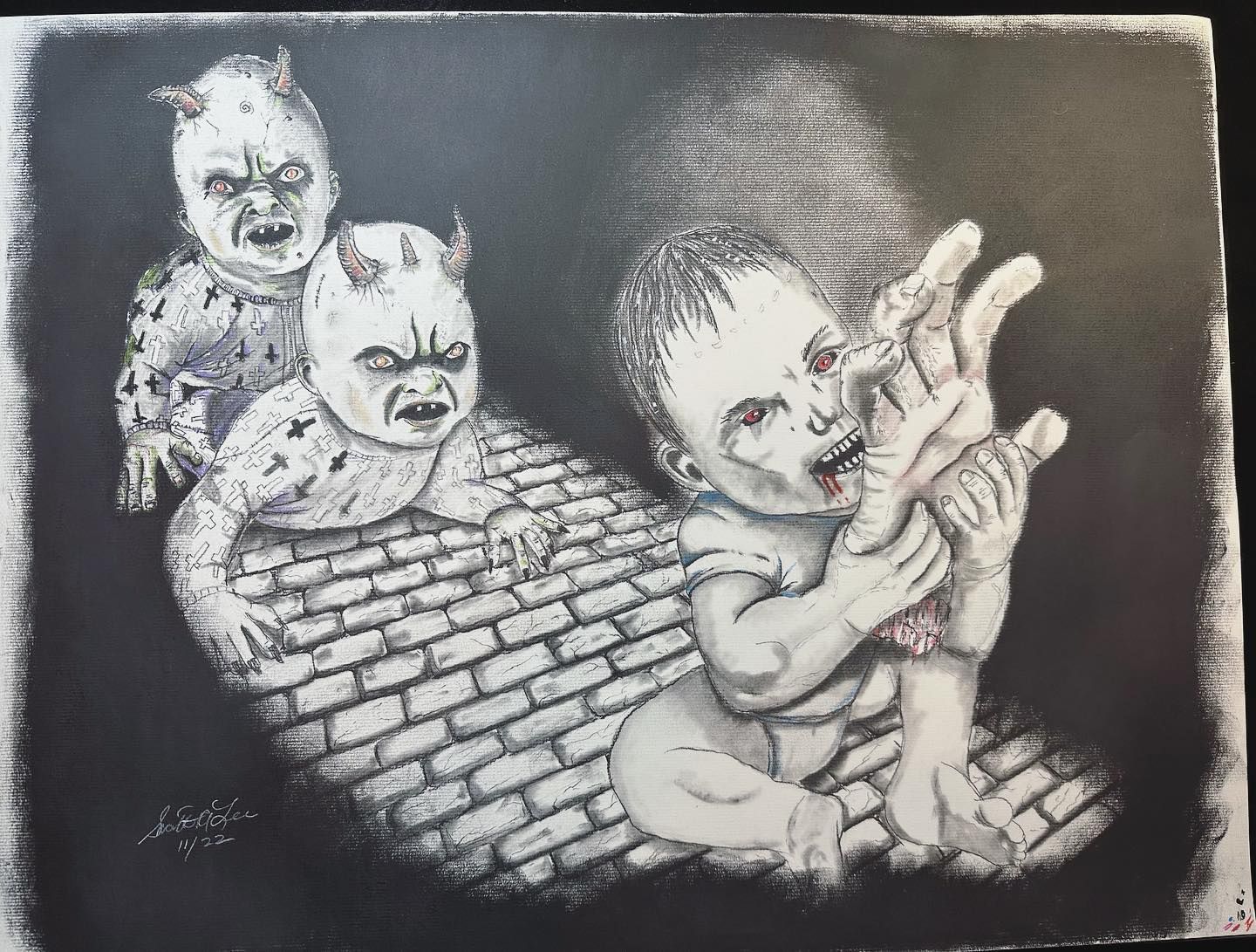 Three grotesque demon babies crawl on a brick floor, one eating its hand.