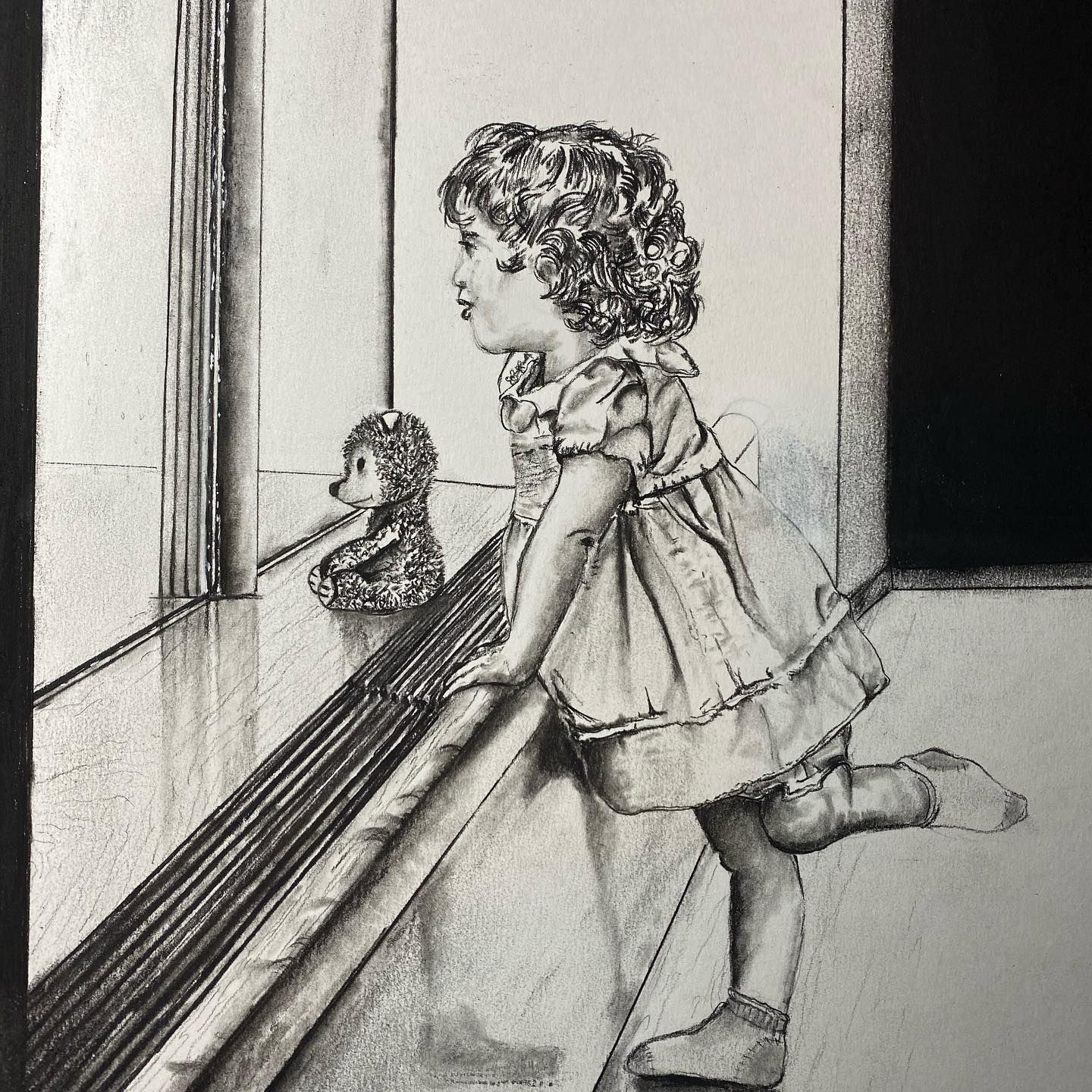 A child in a dress leans on a ledge, blowing a kiss at a stuffed animal on a window sill.