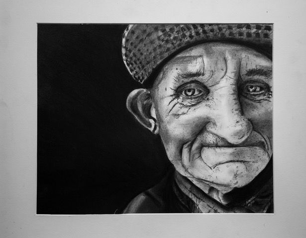 Charcoal drawing of an elderly person with a sad expression, wearing a hat, set against a dark background.