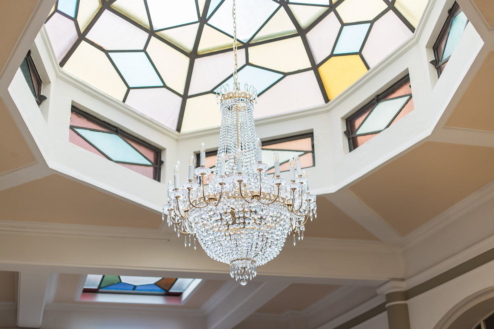 A chandelier is hanging from the ceiling of a building