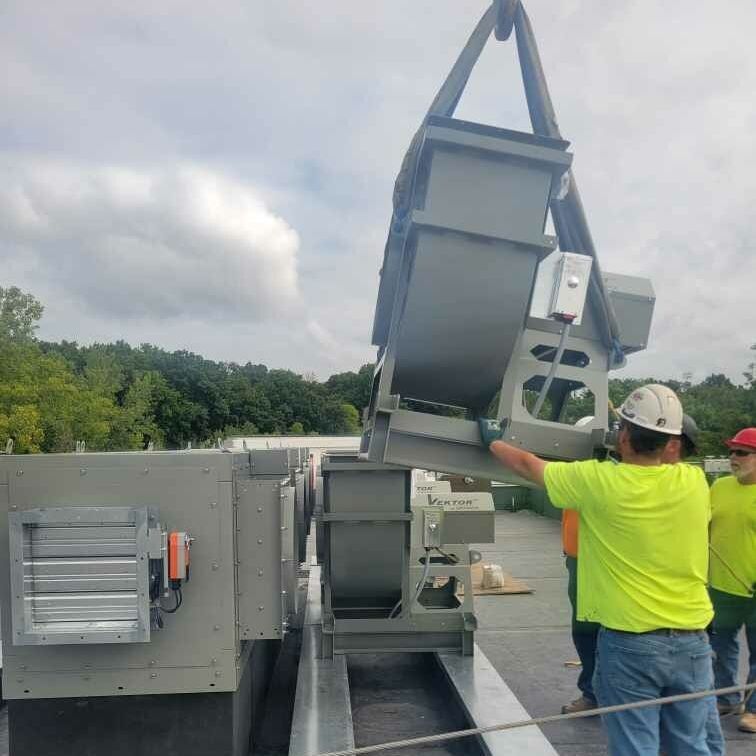 Hulett Heating & Air Conditioning Company’s Construction Workers Install Equipment in Missouri.