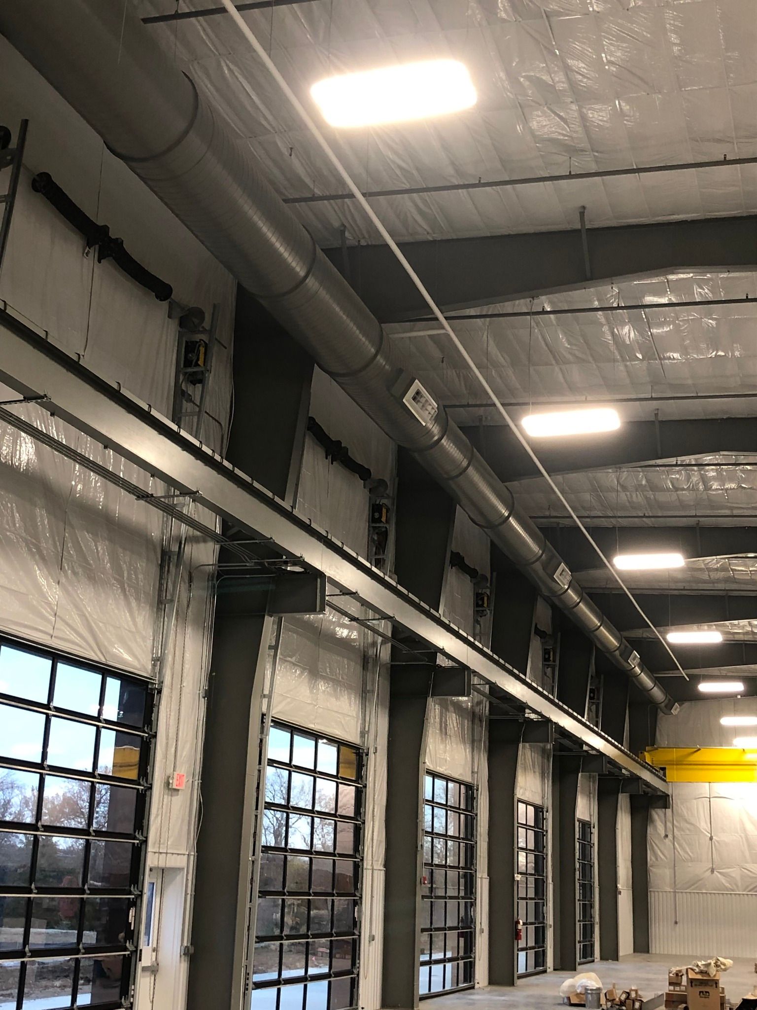Metal Ductwork in a Missouri Warehouse Facility. Hulett Installs Custom Solutions in Missouri.