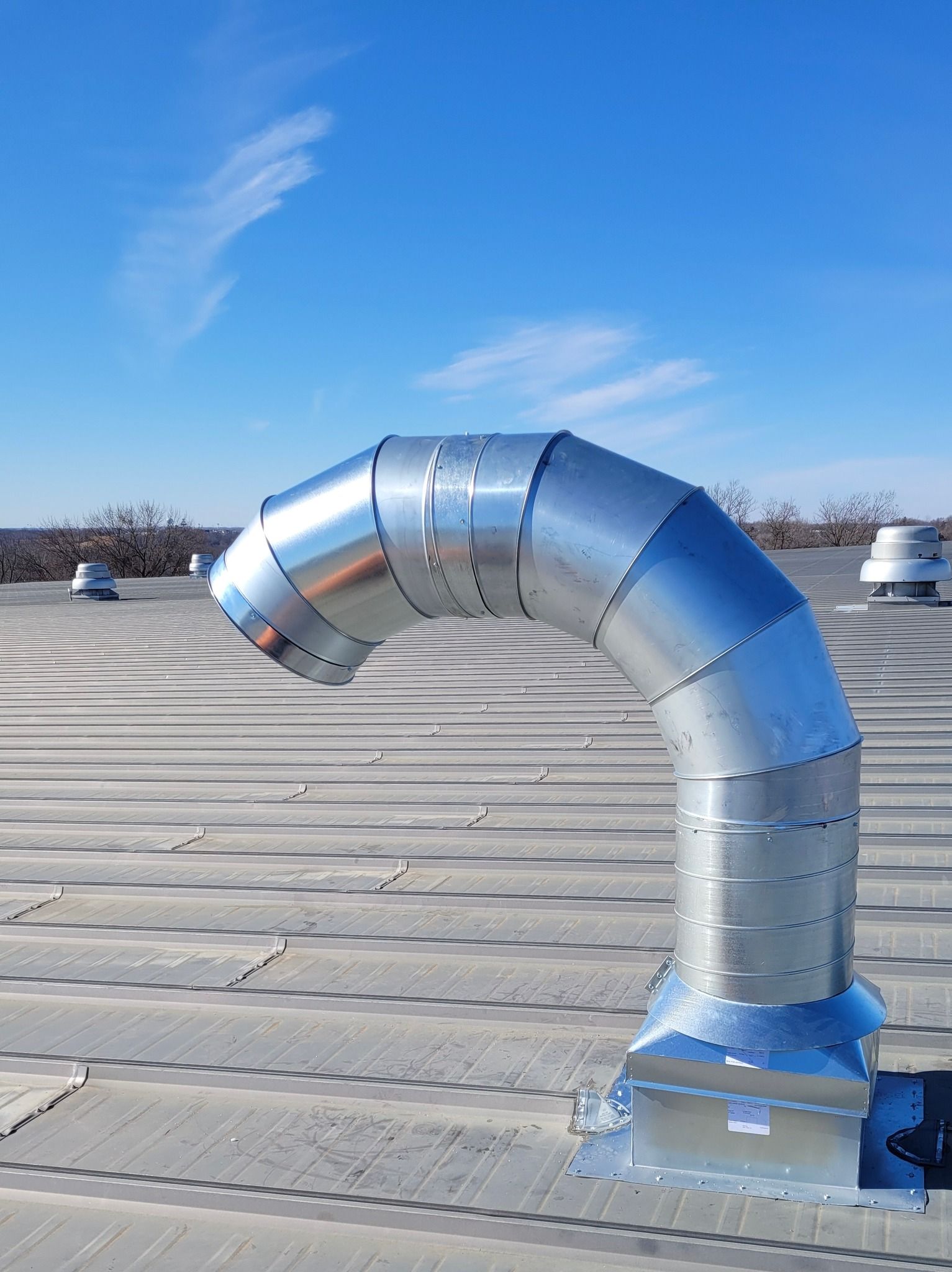 A Custom Fabricated Metal Vent Installed on a Roof in Missouri. Hulett Installs HVAC Solutions.