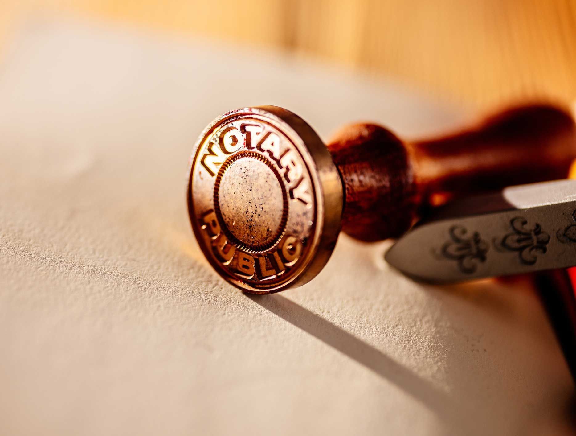A close up of a notary stamp on a piece of paper.