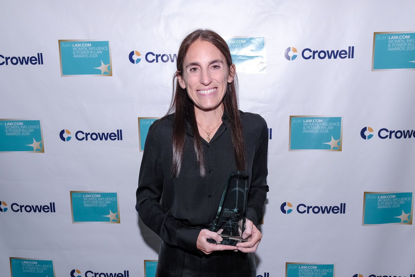 Leslie at the awards dinner with the award