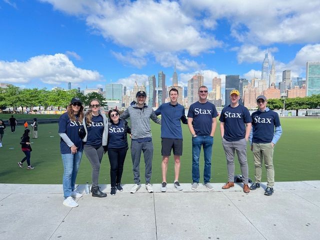 Fellow Stax New York Colleagues gather for a group photo while volunteering for Hunters Point Park.