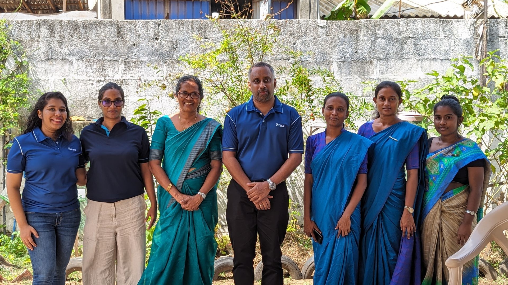 Colleagues from our Stax Colombo gather for a photo while supporting Sardovya's community kitchen program