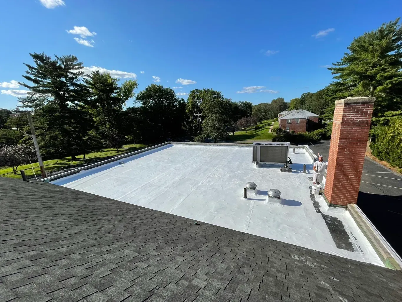 A roof with a white roof and a chimney on it.