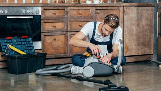 Vacuum Repairs — Professional Repairman Fixing Vacuum Cleaner in Riverside, CA