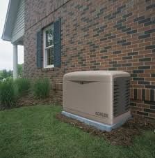 A generator is sitting on the side of a brick house.