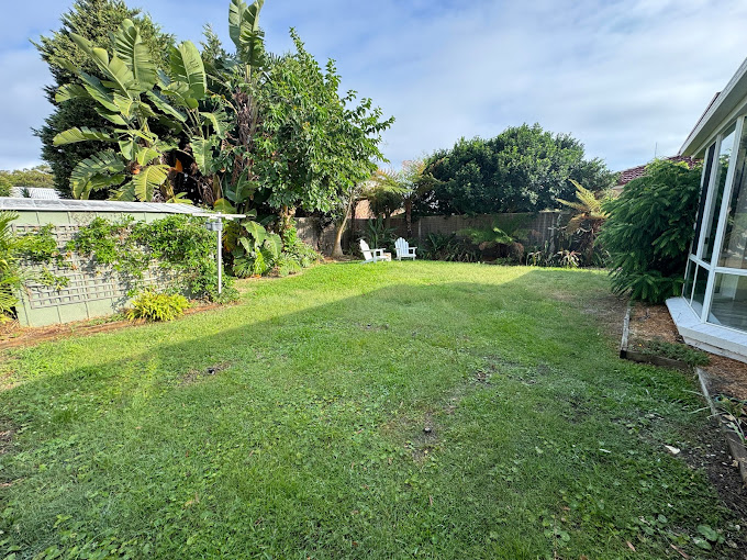 A Grassy Backyard with Trees — Gibbo’s Lawns & Property Maintenance In Salamander Bay, NSW