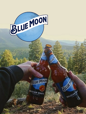 A can of leinenkugel 's beer with a lake in the background