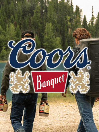 A can of leinenkugel 's beer with a lake in the background