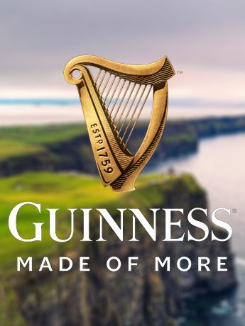 A can of leinenkugel 's beer with a lake in the background