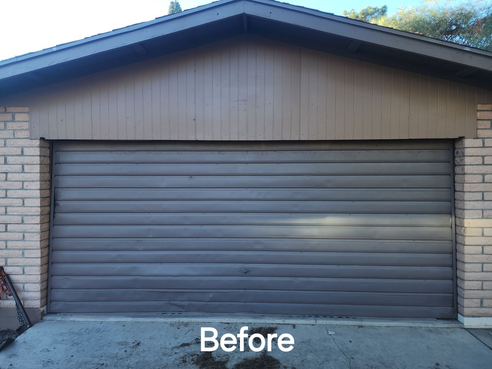 A picture of a garage door before being painted