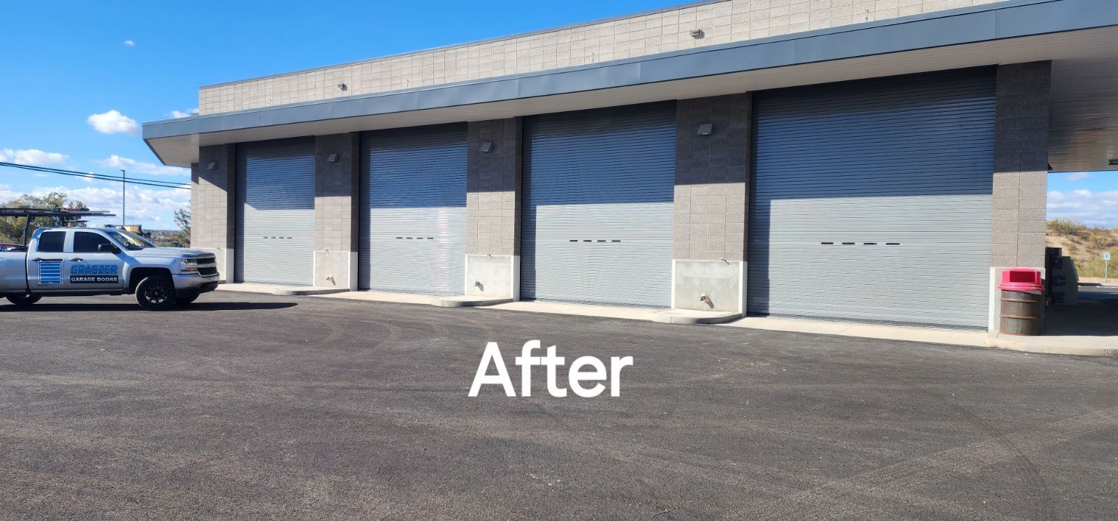 A truck is parked in front of a building with a sign that says after