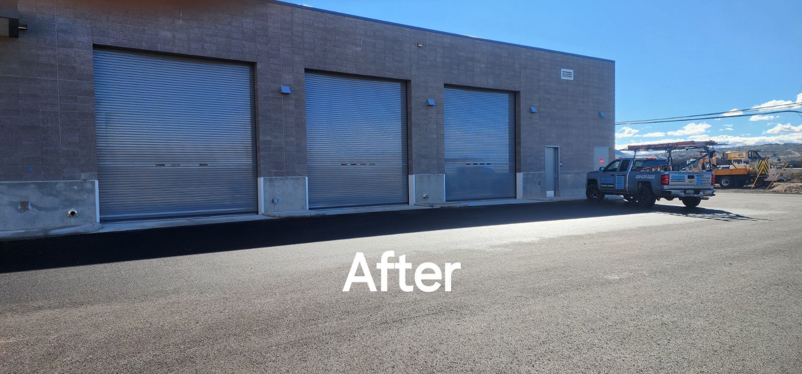 A truck is parked in front of a building that says after