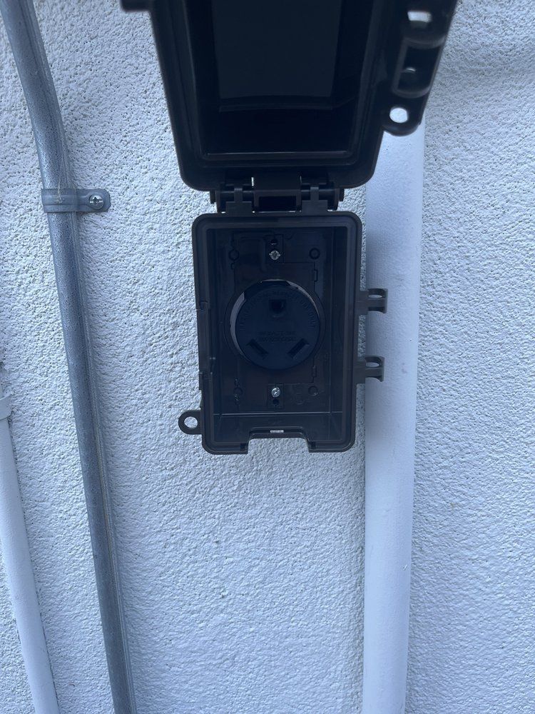 A close up of a electrical outlet on a wall.