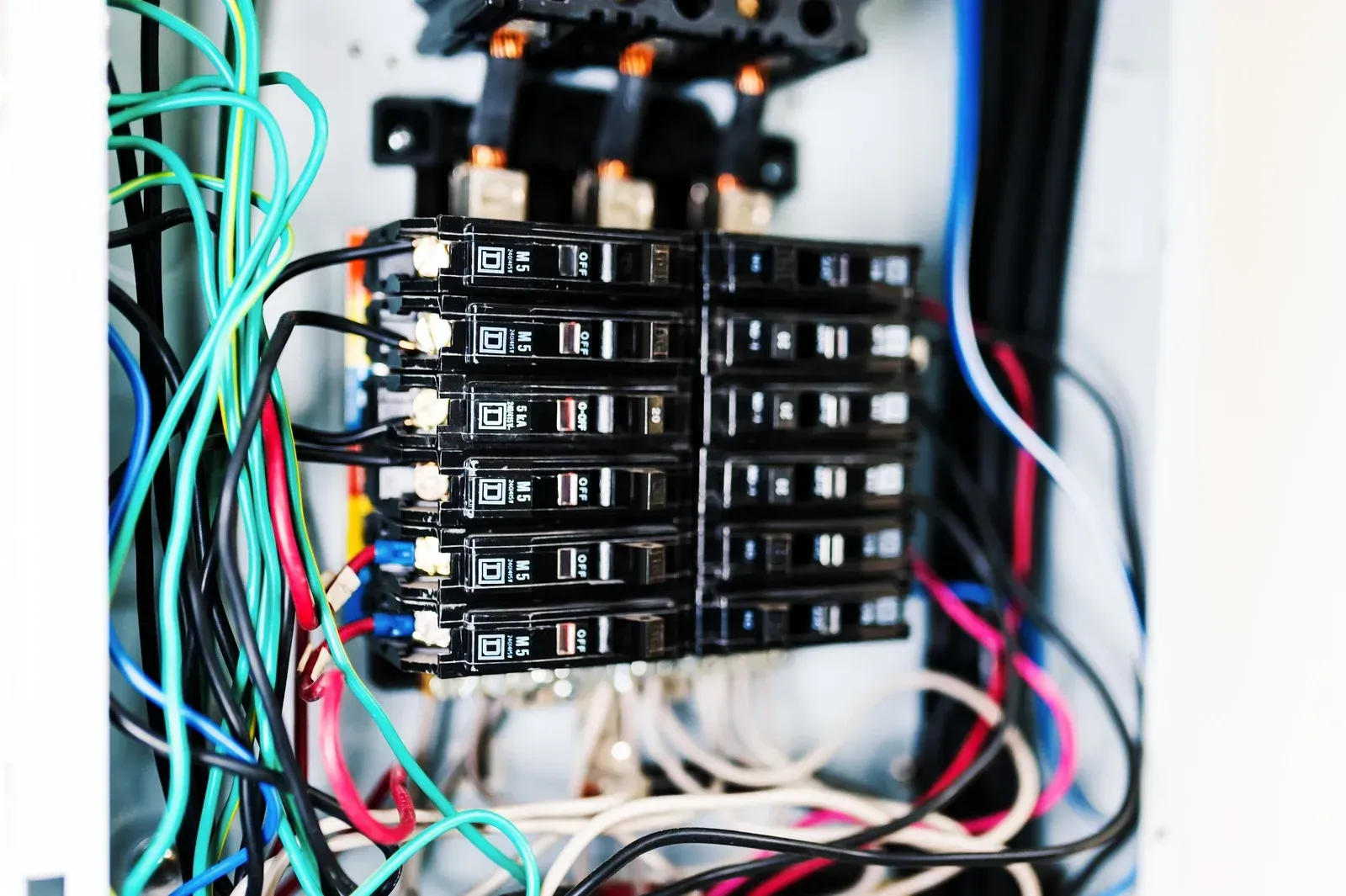 A bunch of wires are connected to each other in a box.