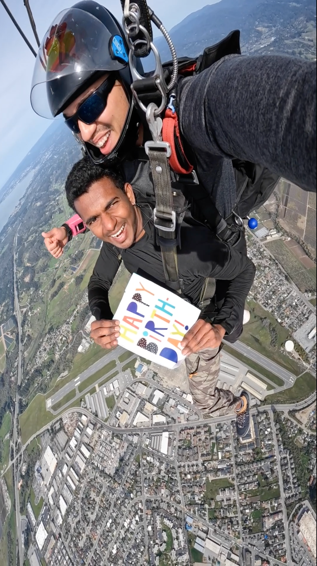 Skydive Santa Cruz Parachute Flight with Happy Birthday Sign