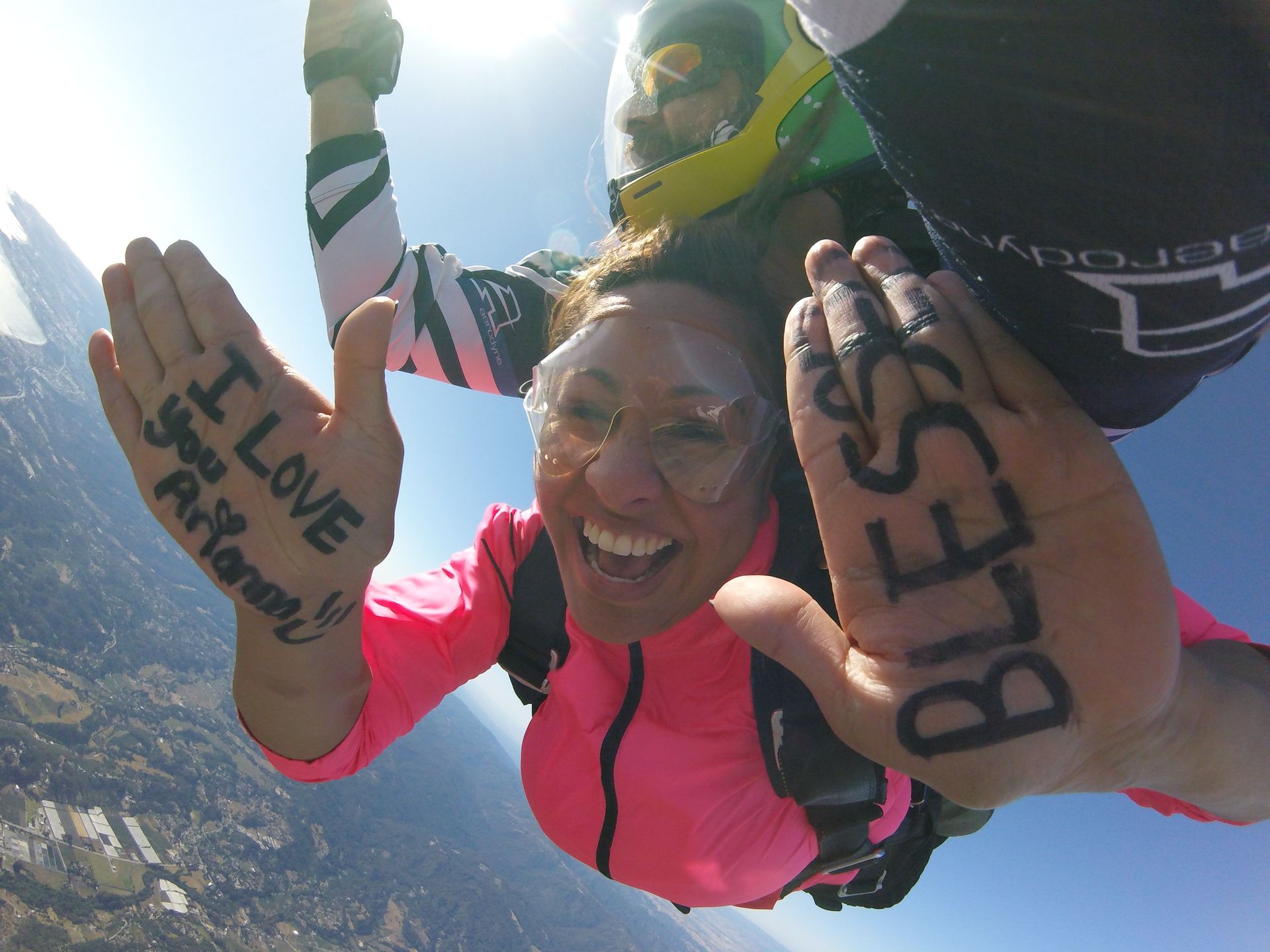 Skydive Santa Cruz woman tandem student freefalling with the words