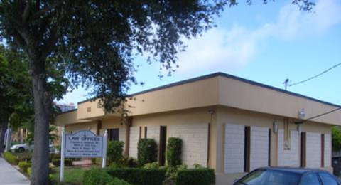 A Car is Parked in Front of a Building of Law Office
